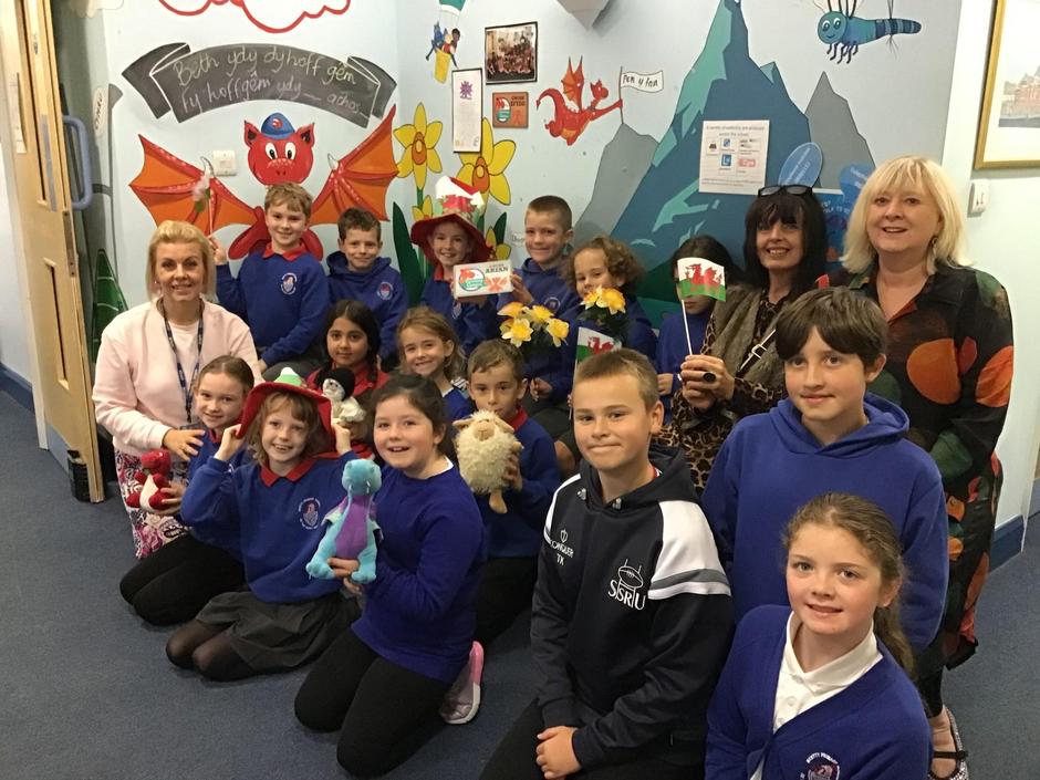 Ein Criw Cymraeg 2024 receiving the Siarter Iaith Arian award from Mrs N Griffiths, our Welsh county advisor.